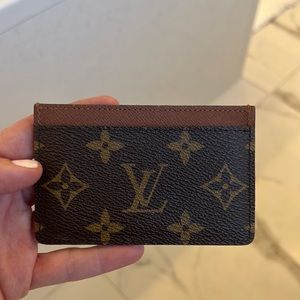Louis Vuitton card holder. One main compartment and two side pockets.